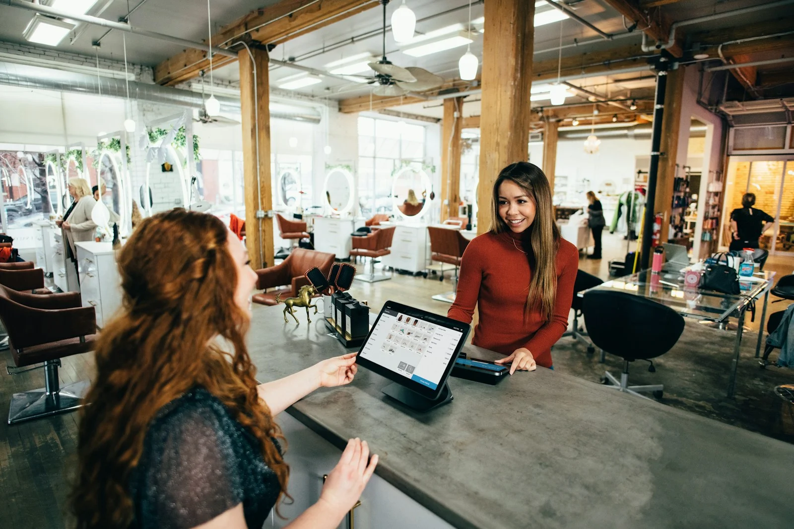 TNS : two women near tables