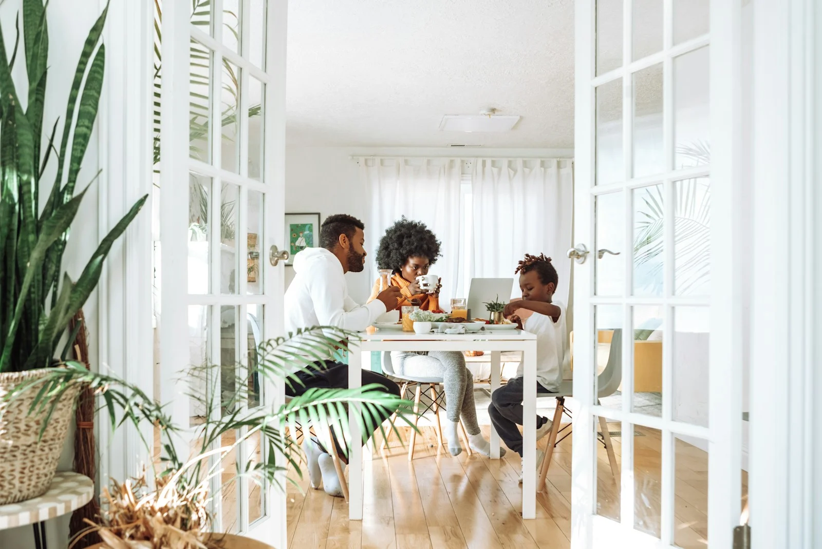 Family people sitting on chairs in front of table